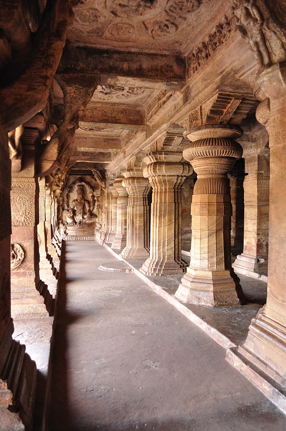 Badami cave temples carved into red sandstone cliffs
